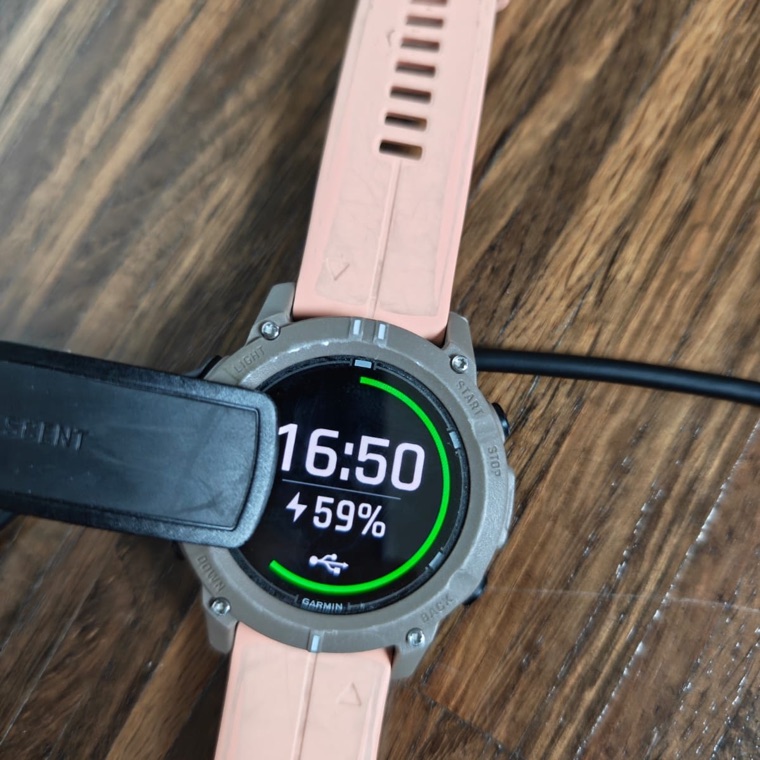 The watch showing the charge screen with a USB symbol.
